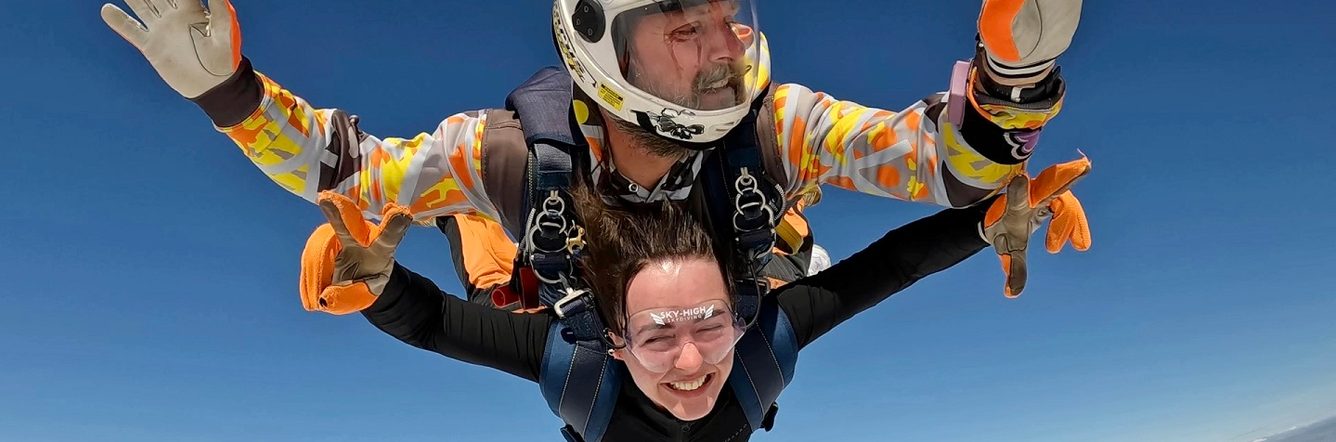 Sara posing while parachuting