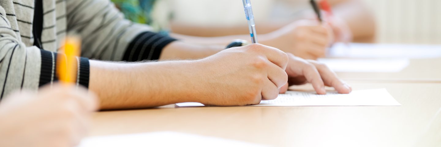 Students taking notes in lecture