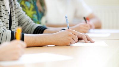 Students taking notes in lecture