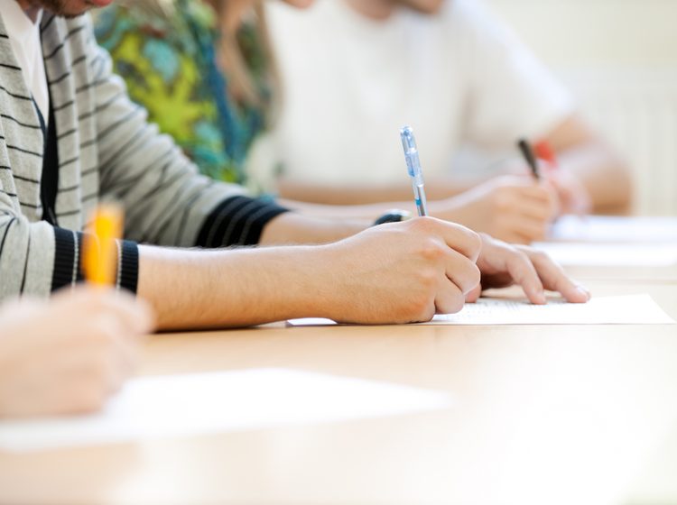 Students taking notes in lecture