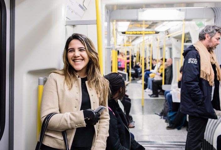 Student smiling while commuting