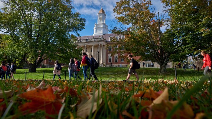 University of Connecticut students walk past the Wilbur Cross Building