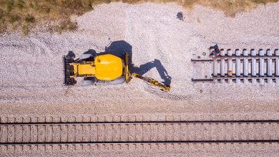 Railway workers repairing a broken track