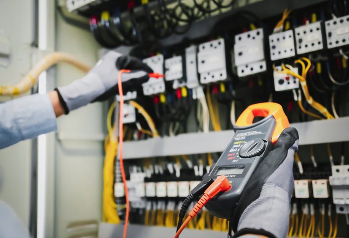 Electrical engineer testing electrical installations and wirings