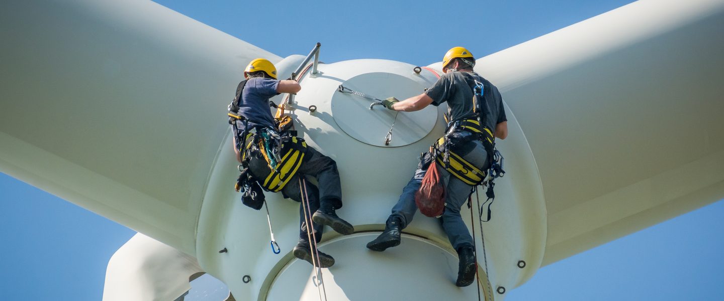 Environmental engineers working on wind turbine