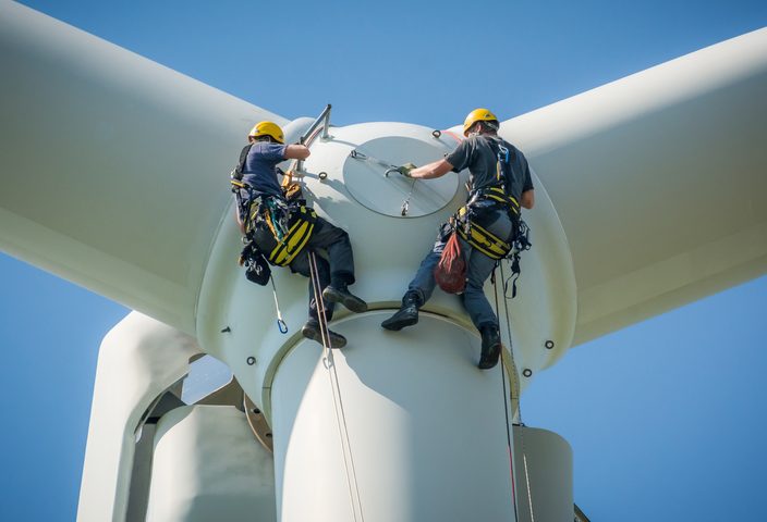 Environmental engineers working on wind turbine