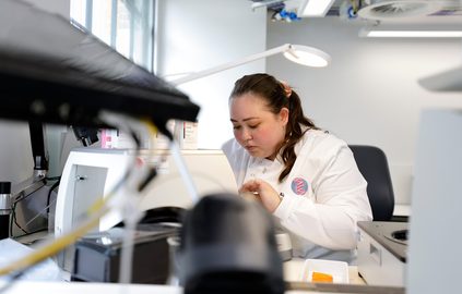 Natalie a UBIC student working in a lab in London