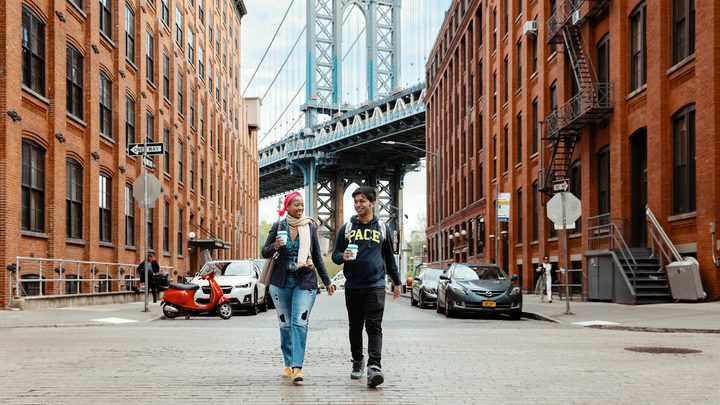 Pace University students walking near Williamsburg bridge