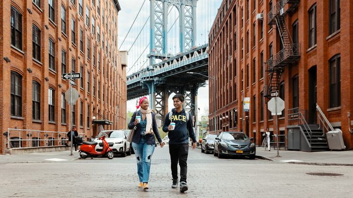 Pace University students walking near Williamsburg bridge