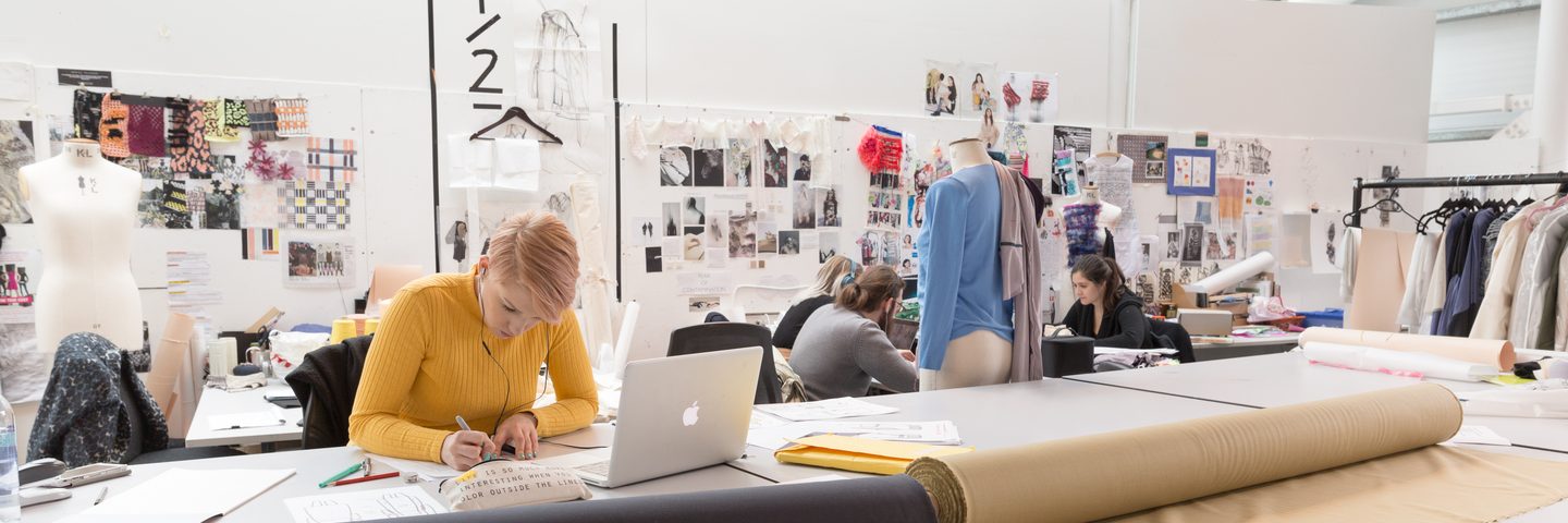 Nottingham Trent University fashion design students working on their designs in studio