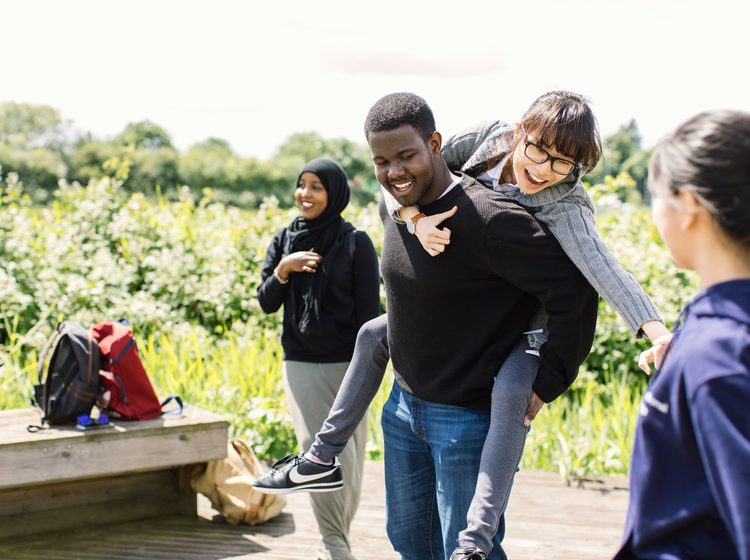 University of Nottingham International College students having fun outside during break