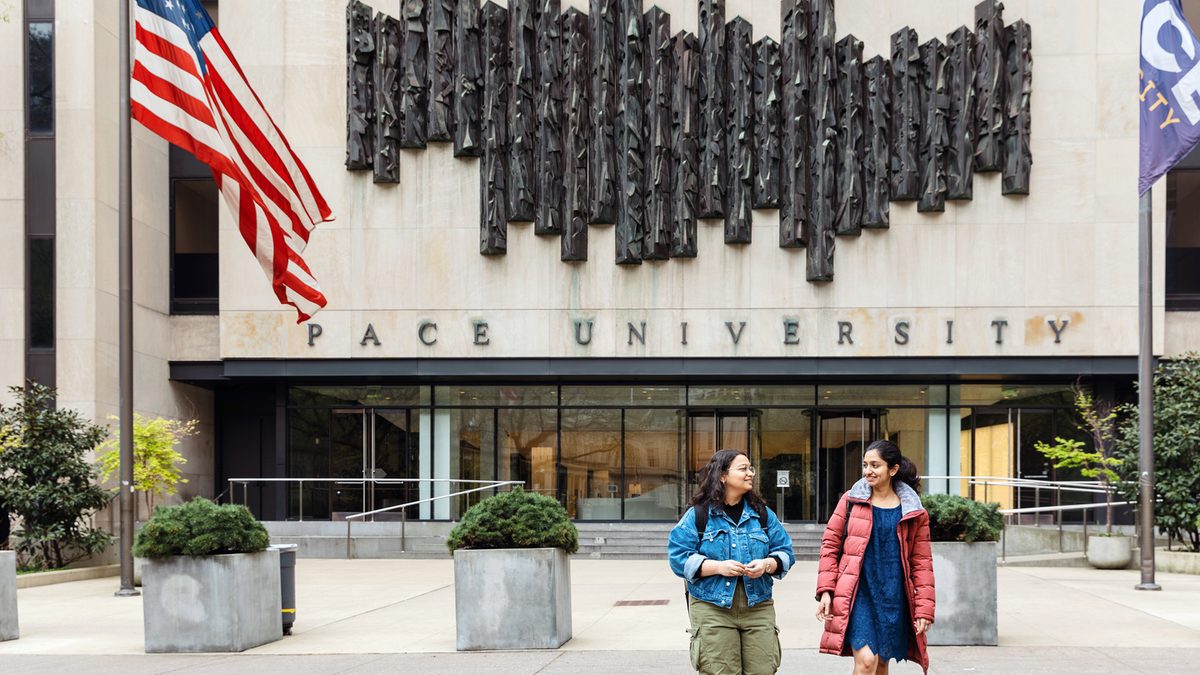 Pace University students walking in campus entrance way