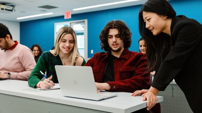 Pace university students and staff in a classroom