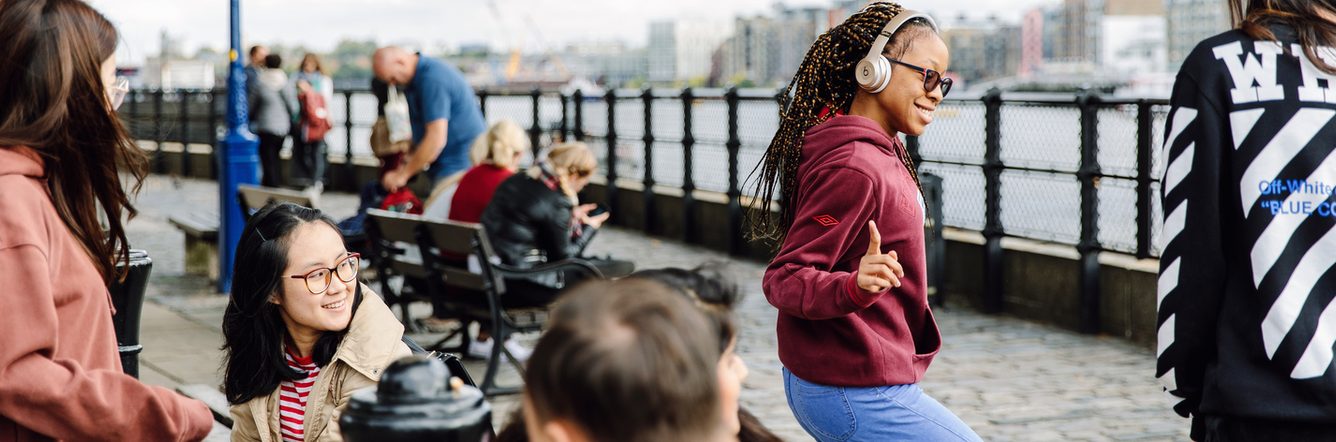 Students socialising by the London Thames