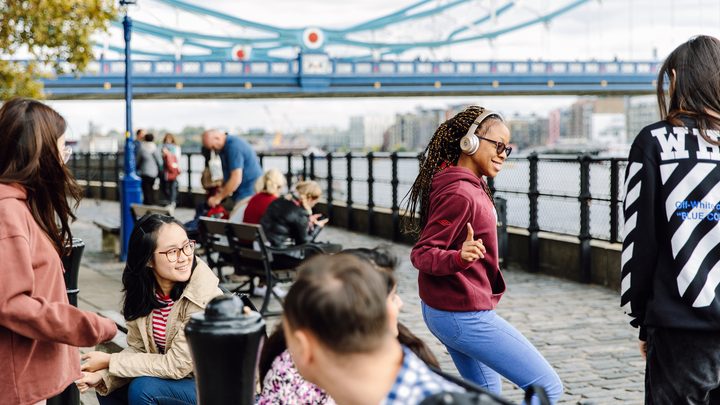 Students socialising by the London Thames