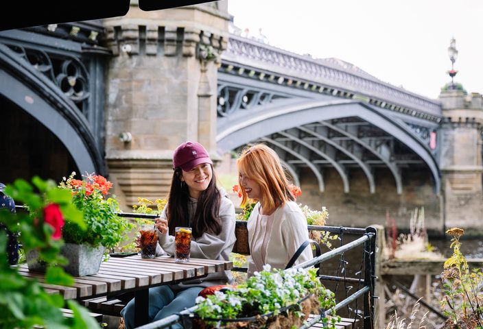 Students enjoying a soft drink near Skeldergate bridge