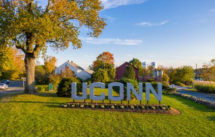 Aerial view of the large UConn sign in the campus entryway