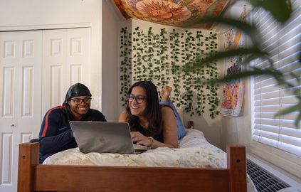 ASU students hanging out in a dorm room at Lake Havasu campus