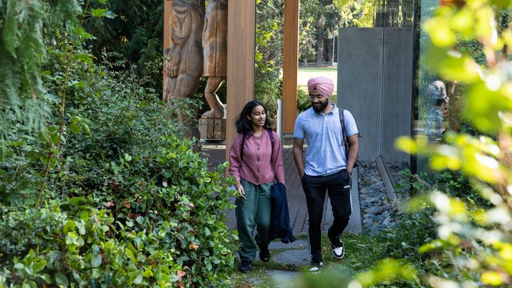 Two University of Victoria students walking on campus