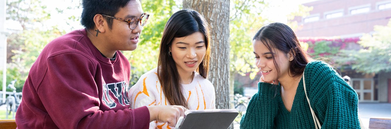 UVic students looking at a tablet