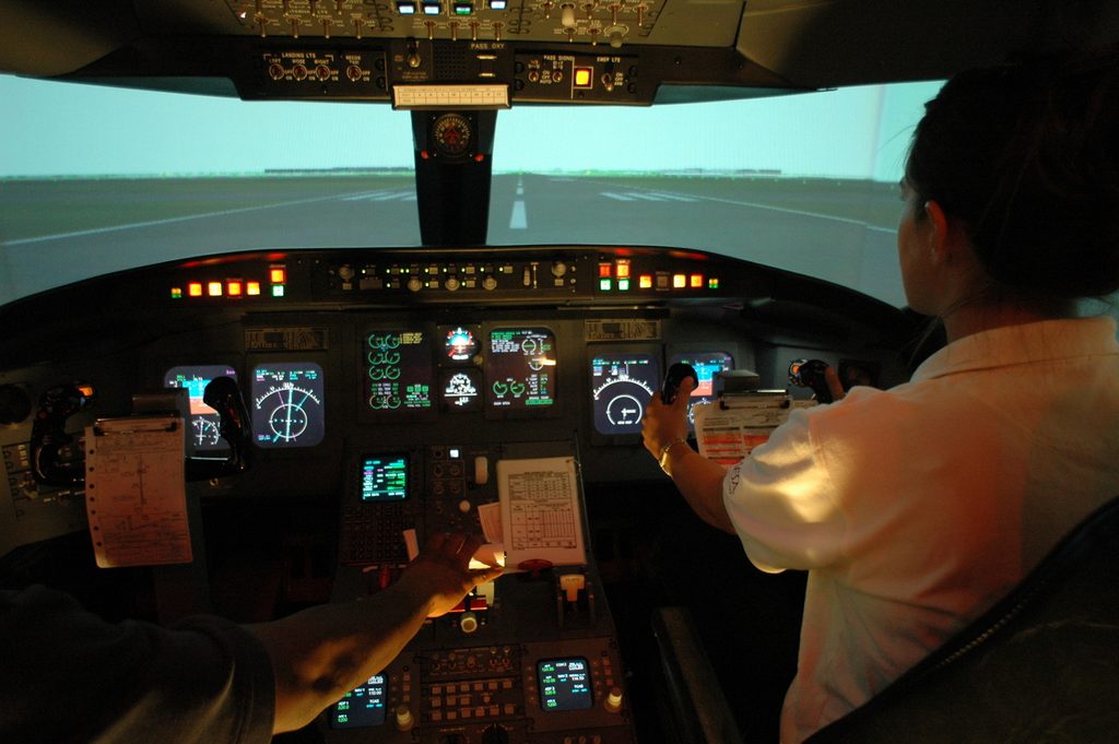 student operating the flight simulator at ASU Polytechnic campus