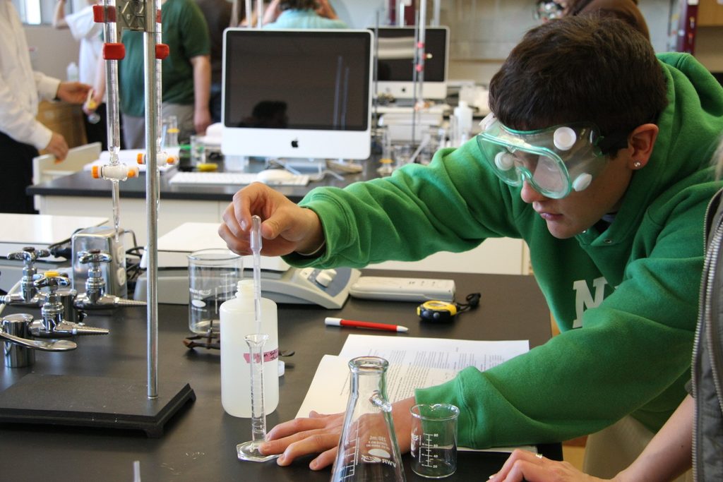 student conducting experiment at ASU Polytechnic chemistry lab