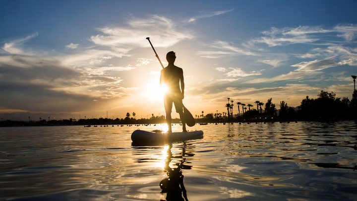 Arizona State University students paddle board down to Lake Havasu