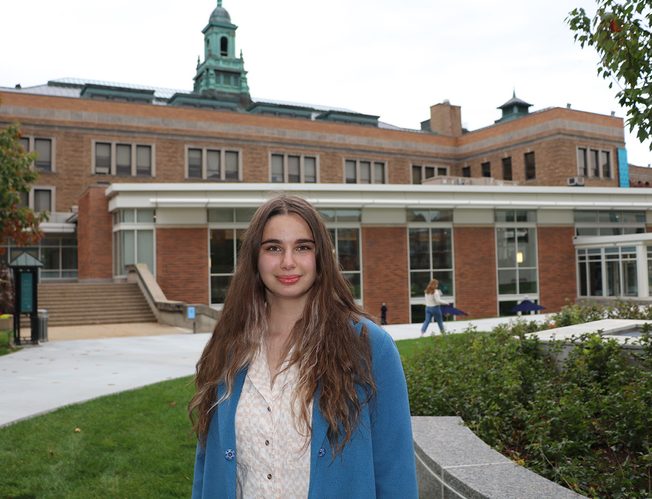 Simmons university student Kate posing at campus