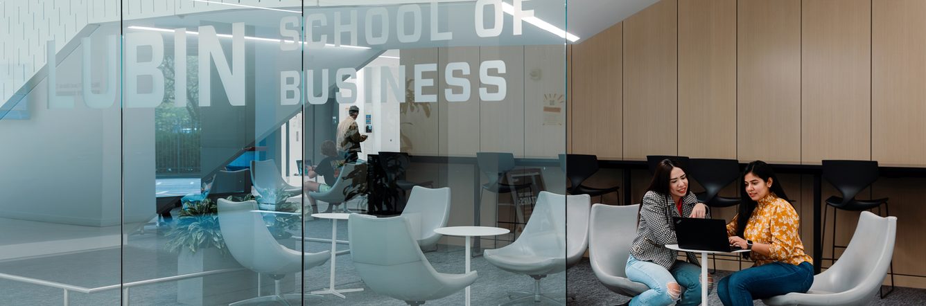 Two Pace University students in a discussion at the Lubin School of Business building