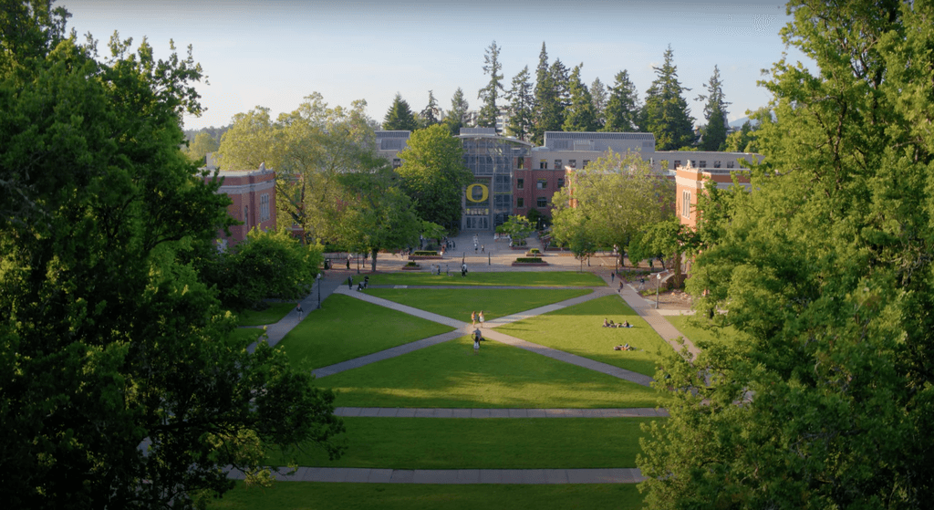 Open green space at the University of Oregon campus with walkways for students through its centre