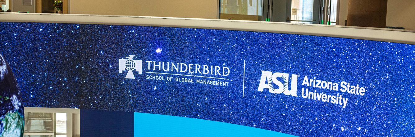 Thunderbird School of Global Management logo on screen at Downtown Phoenix campus building