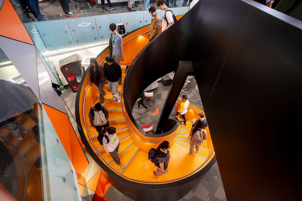 U of A Student Innovation Center that features a bright orange spiral staircase
