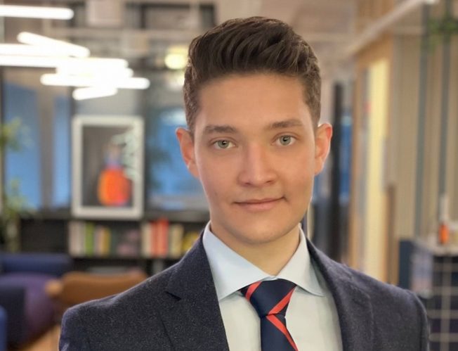 Karl Eshwer, a student from Pace University, posing for a picture