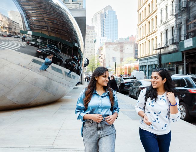 Two students walking in New York City