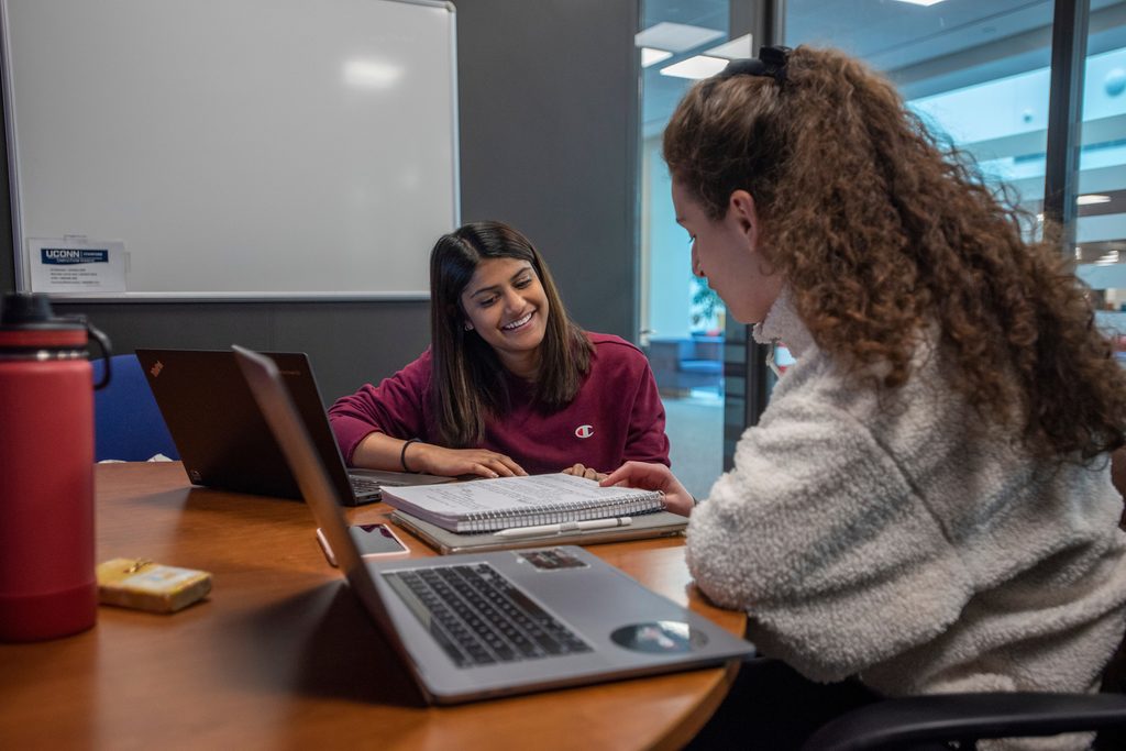 Students working on a group project at the UConn Stamford Library