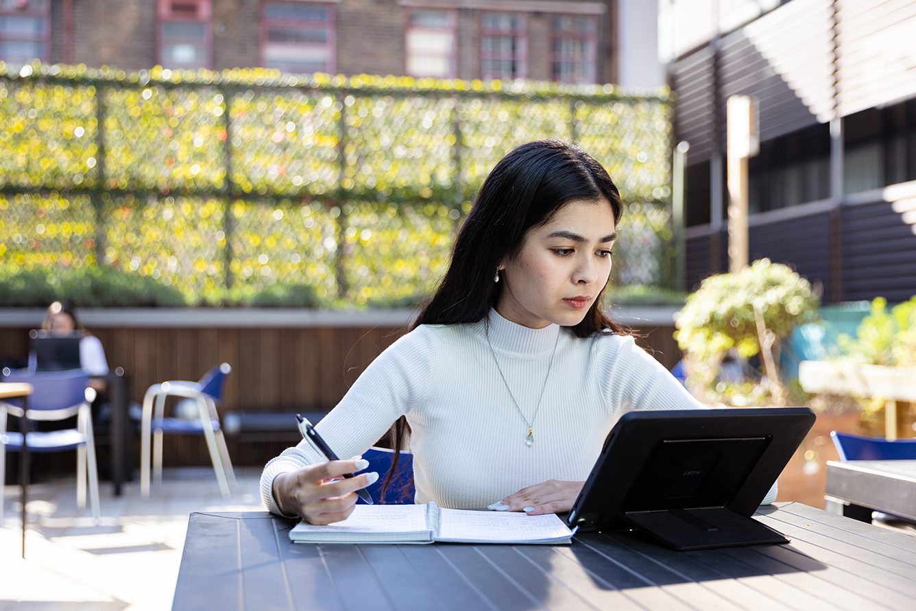 A student using the Kaplan Pathways degree finder on her tablet