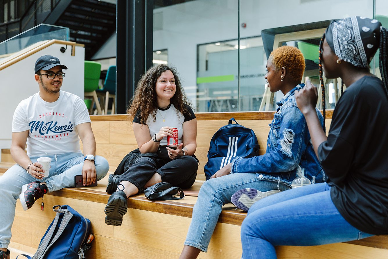 A student talking with a college director