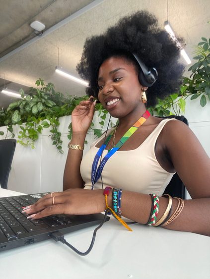 Eniola during her internship at Kaplan at the desk