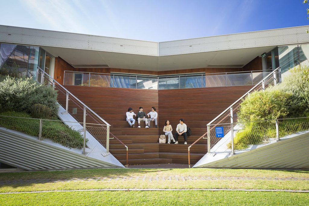 Students sitting on the steps at Adelaide University