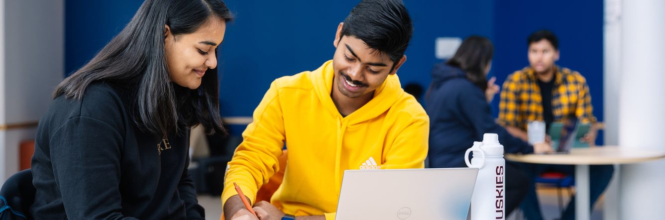 Students studying with a laptop