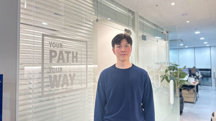 Jason posing in the Kaplan office