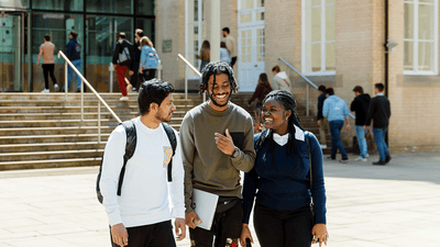 Group of students walking near campus