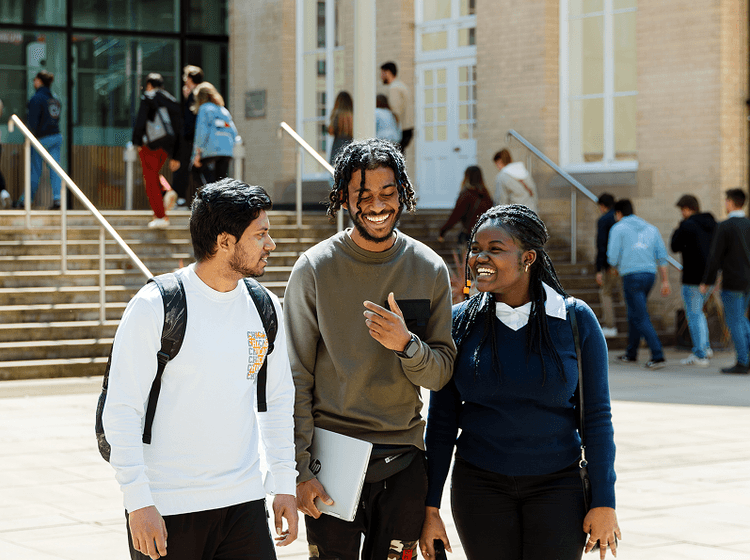Group of students walking near campus