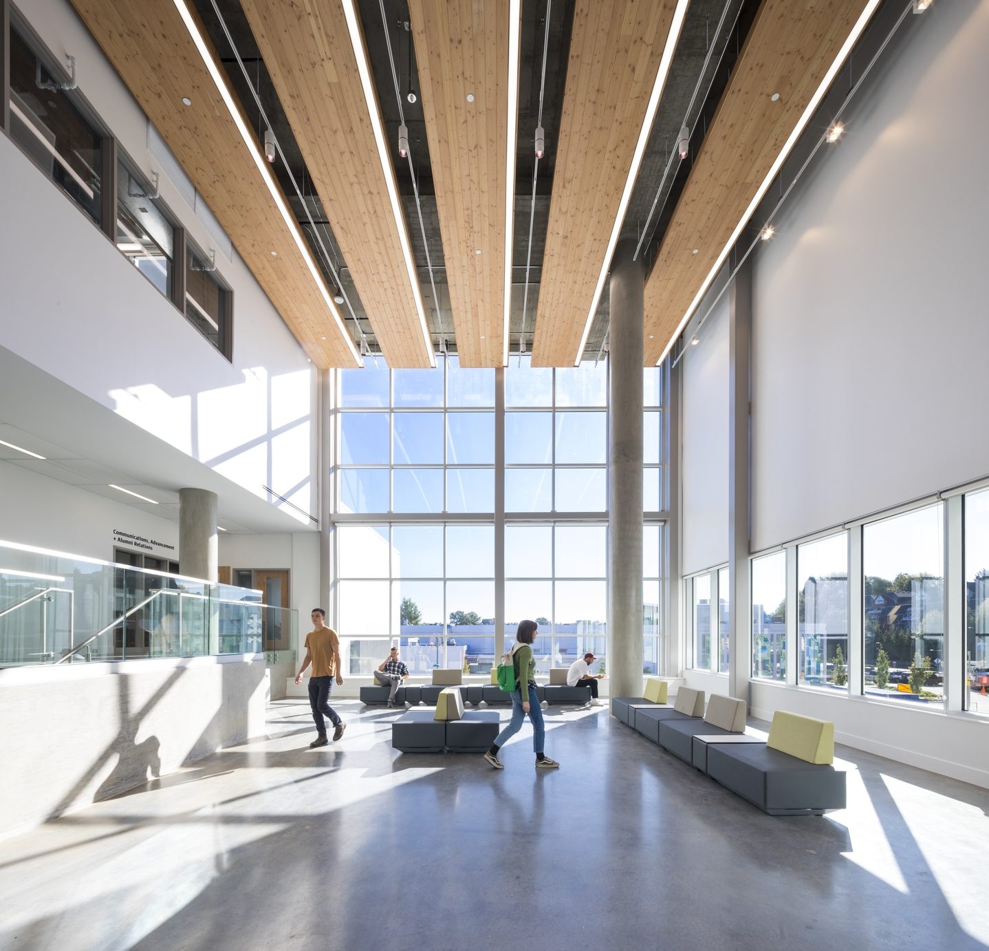 Students using a bright open lobby and common area at Emily Carr University