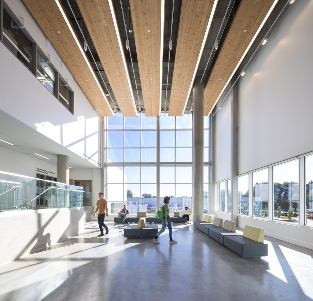 Students using a bright open lobby and common area at Emily Carr University