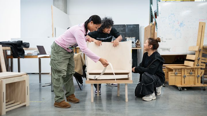 Students collaborating on a design and furniture-making project in a studio workshop at Emily Carr University.
