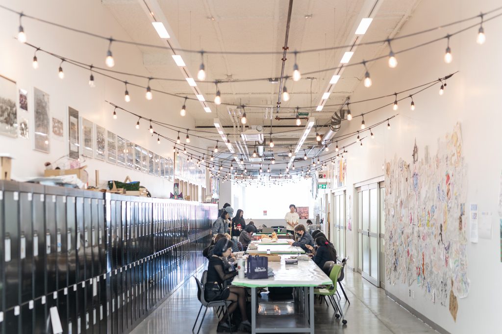 Students working and collaborating in a creative common area at Emily Carr University.